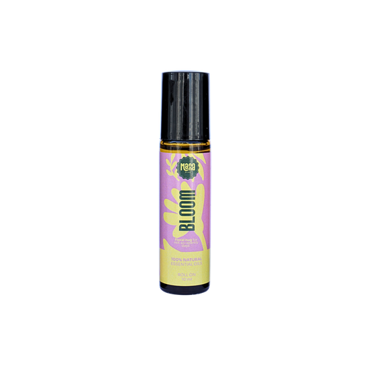 Manna BLOOM aroma roller, a 10 ml amber glass bottle with a pink and yellow label