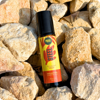 The STEEL aroma roller resting on pale stones