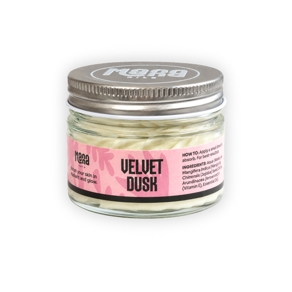Manna Velvet Dusk body butter in a clear glass jar with a silver lid and a pink label